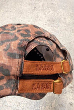 Load image into Gallery viewer, SABBI THE WHO THE BUCK CARES CAP